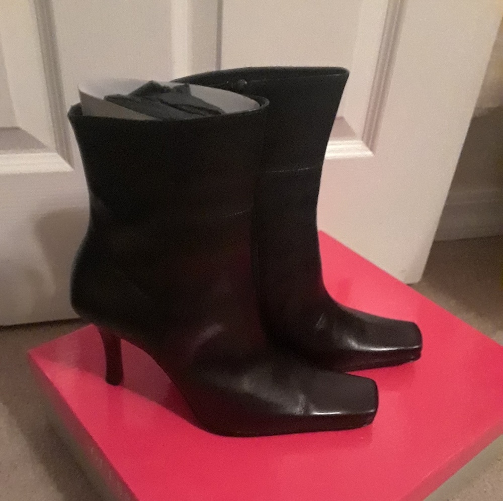Black high heeled booties.